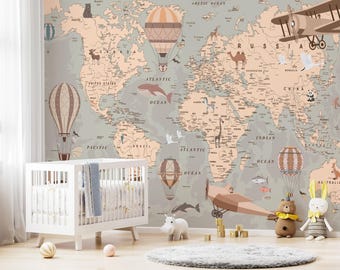 May include: A nursery scene with a white cot, toys, and a world map mural. The map is in muted tones with illustrations of hot air balloons, aeroplanes, and animals. A rug and decorative balls complete the playful setting.