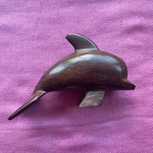 Wooden dolphin statue