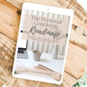 May include: A tablet computer displaying a digital document titled "The Personal Concierge Roadmap". The document has a light brown background with a floral design and the text "Map out your personal concierge business ready for launch". The bottom of the document reads "The Concierge Society".