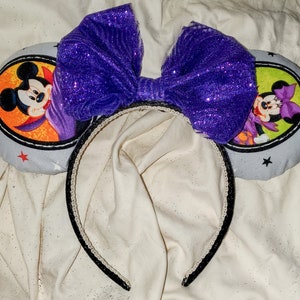 A Halloween Portraits Mickey As Vampire, Minnie in Pumpkin Dress Pluto the pirate Donald the Devil Minnie Ears Purple Sparkly Bow Disneyland