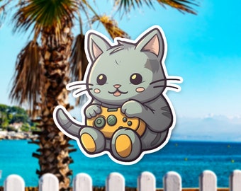 May include: A cartoon gray cat with big eyes and a happy expression is holding a yellow video game controller. The cat is sitting on a white background.