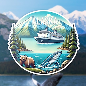 May include: A circular sticker featuring a cruise ship sailing on blue water in front of snow-capped mountains. The word ALASKA is printed in white at the top. A brown bear stands on the grassy shore, and a blue whale breaches in the water below.