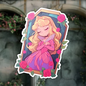 May include: A sticker featuring a cartoon illustration of Sleeping Beauty, a princess with blonde hair and a pink dress, sleeping in a coffin surrounded by pink roses.