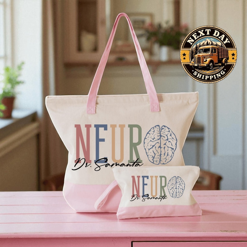 A pink tote bag with the text "NEURO Dr. Samanta" printed on it, along with a smaller bag or pouch that also has the same text. The bag is placed on a pink surface, and there is a logo for "Next Day Shipping" in the background.