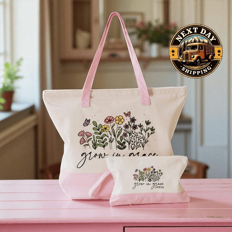 A pink tote bag with a floral design and the text " Grow in grace" printed on it, along with a smaller white bag with the same floral design and text. The bags are placed on a pink surface, and there is a logo for "Next Day Shipping" in the background.