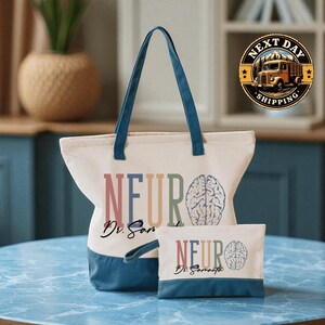 A tote bag with the word "NEURO" printed on it, along with a smaller bag that also has the word "NEURO" printed on it. The bags are placed on a blue marble table.