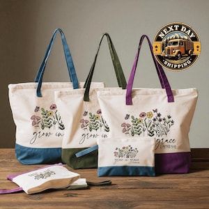 a collection of three tote bags with floral designs, arranged on a wooden surface.