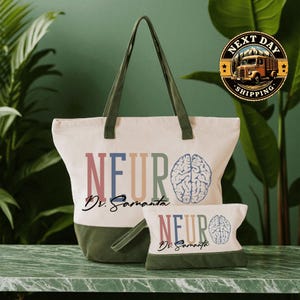 A large tote bag with the text "NEURO Dr. Samanta" printed on it, along with a smaller bag with the same text. The bags are placed on a marble countertop, and there is a green plant in the background.