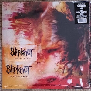 May include: A sealed vinyl record album featuring the band Slipknot. The album cover has a fiery, abstract design in shades of red, orange, and yellow. The album title is "The End, So Far" and includes the text "The End For Now..." and "Limited Edition Neon Yellow Vinyl."