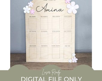 Puede incluir: Un gráfico de crecimiento de madera con un diseño floral rosa y blanco. El gráfico está etiquetado como "One Year of Amina" y tiene espacios para cada mes del año. El gráfico está etiquetado como "Laser Ready, Digital File Only".