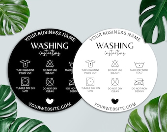 May include: Two circular laundry care instruction labels, one black and one white, with symbols and text. The labels include instructions such as "Turn garment inside out" and "Machine wash cold." The bottom of each label displays a website address.