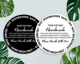 May include: Two round black and white stickers with the text "Your cup was Handmade with love and attention to detail, please be aware that all handmade items may contain small imperfections. Please Handle With Care. Not Dishwasher Safe ~ Do Not Soak ~ Hand Wash Only ~"