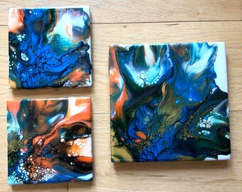 6" x 6" Trivet, and two 4-1/2" x 4-1/2" Ceramic Coasters, Abstract Fluid Pour Painting, blue, orange, green, gold, Shiny Resin Finish