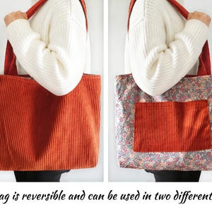 May include: Reversible tote bag with corduroy exterior in a burnt orange color. The bag has a floral print interior with a matching corduroy pocket. The bag has red straps and the text "The bag is reversible and can be used in two different ways."