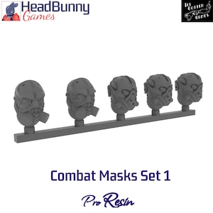 May include: A set of five gray combat masks on a gray sprue. The masks have a detailed, futuristic design, with various shapes and features. The text "Combat Masks Set 1" and "Pro Resin" are visible.