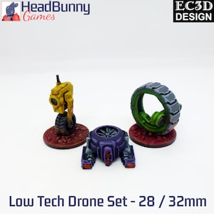May include: A set of three 28/32mm scale low tech drones. One drone is yellow with a single wheel, another is purple with two small thrusters, and the third is a green wheel with a black tire.