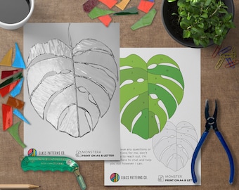 May include: A printable pattern for a stained glass monstera leaf. The pattern is numbered and includes a color guide. The text on the page reads "Monstera Print on A4 & Letter".