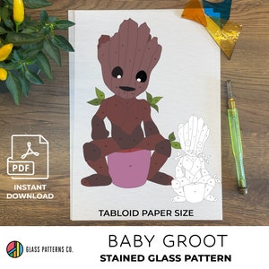 May include: A stained glass pattern of Baby Groot from Guardians of the Galaxy. The pattern is printed on white paper and is ready to be cut out and assembled. The pattern is tabloid size.