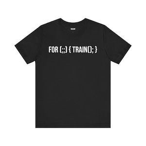 May include: A black short-sleeved t-shirt featuring white printed text on the chest that reads FOR (;;){ TRAIN(); } and a small TKD WIT logo printed in white on the inside neck label area. The shirt has a crew neckline and a standard fit.