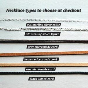 May include: Six different necklace chain types to choose from at checkout.  The options include 925 sterling silver cable, 925 sterling silver figaro, grey microsuede cord, brown microsuede cord, tan microsuede cord, and black waxed cord.