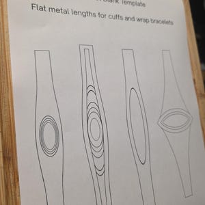 May include: A printed paper with the text "Groombridge Opals Templates" and "Bracelet Blank Template". The paper shows four different flat metal length designs for cuffs and wrap bracelets, each with a unique central design.