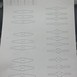 May include: A printed ring shank template labelled "Oval 1." The template includes a size chart with measurements in millimetres, US sizes, and AU/UK sizes. The template also features various ring shank designs.