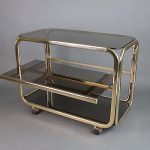 Vintage barwagen jaren 70 | Serveertrolley van gerookt glas | Goudkleurig metalen frame | Moderne meubels uit het midden van de eeuw