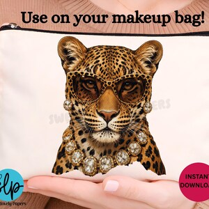 May include: White makeup bag featuring a leopard wearing sunglasses, earrings, and a necklace. The bag has a black zipper and the text "Use on your makeup bag!" is printed on the top. A red circle with "INSTANT DOWNLOAD" is on the bottom right.