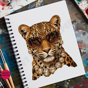 May include: A leopard illustration wearing sunglasses and a diamond necklace and earrings. The leopard has a spotted coat and is drawn on a white spiral-bound sketchbook. Paintbrushes and a watercolor palette are in the background.
