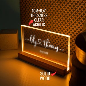 a light up acrylic sign on a table