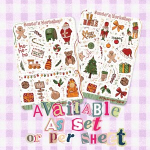 May include: Two rectangular sticker sheets titled Santa's Workshop featuring various Christmas illustrations including Santa, a gingerbread man, a teddy bear, a train, a Christmas tree, gifts, and holiday text. The text Available As Set or per Sheet is below.