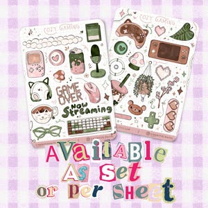 May include: Two sticker sheets featuring illustrations of gaming equipment, including a handheld console, microphone, keyboard, mouse, and cat-themed accessories in shades of pink, green, and brown, with text reading Cozy Gaming, Game Over, and Now Streaming.