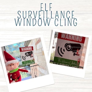 May include: Two red and green warning signs with a black and white camera graphic and the text "Warning This House is Under Elf Surveillance". The signs are displayed in a window with a Christmas elf doll in the foreground.