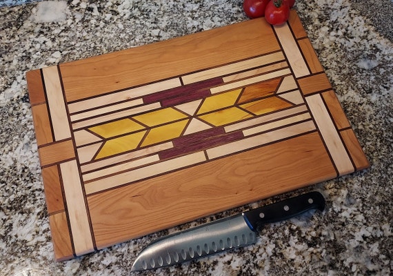 A beautifully handcrafted end-grain or live-edge cutting board at the 'heirloom' price point — the name 'Audrey' and 116 favorites signal a genuinely distinctive, artisan piece people gift and keep forever.