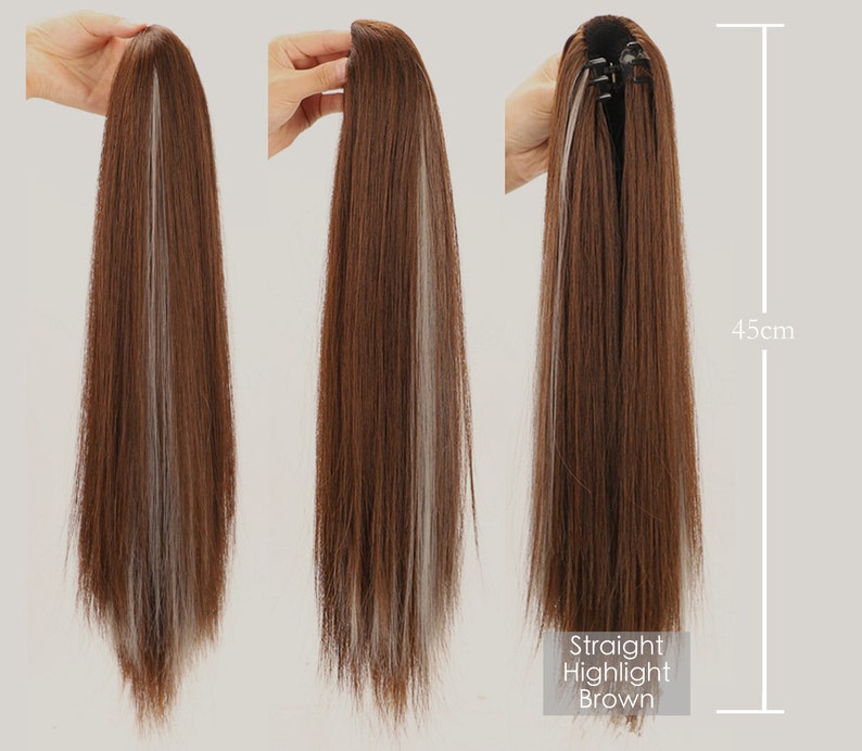 K&ouml;nnte beinhalten: Eine lange, gerade braune Haarverl&auml;ngerung mit hellblonden Str&auml;hnen. Die Verl&auml;ngerung ist 45 cm lang und hat einen Clip-In-Mechanismus.