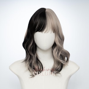 May include: A two-tone wig with a split design, black on the left and light grey on the right. The wig has a wavy texture and bangs, styled on a mannequin head. The text "king COLOR" is visible at the bottom.