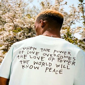 When the power of love overcomes the love of power the world will know peace Shirt | Unisex Heavy Cotton Tee