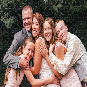 May include: A family portrait with a father, mother, two daughters, and a son. The father is wearing a gray suit jacket and the mother is wearing a white dress. The daughters are wearing pink dresses and the son is wearing a white shirt and gray vest.