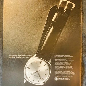 1966 Annuncio stampato vintage con piccolo poster The Electric Timex