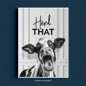 May include: Black and white photo of a cow with its mouth open, looking surprised. The cow is peeking through a white door frame. The text "Herd That" is written above the cow.
