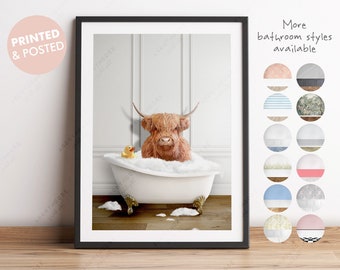 May include: A Highland cow in a white bathtub with a yellow rubber ducky. The cow is brown and has a white face. The bathtub is filled with bubbles. The background is a white wall with white trim.