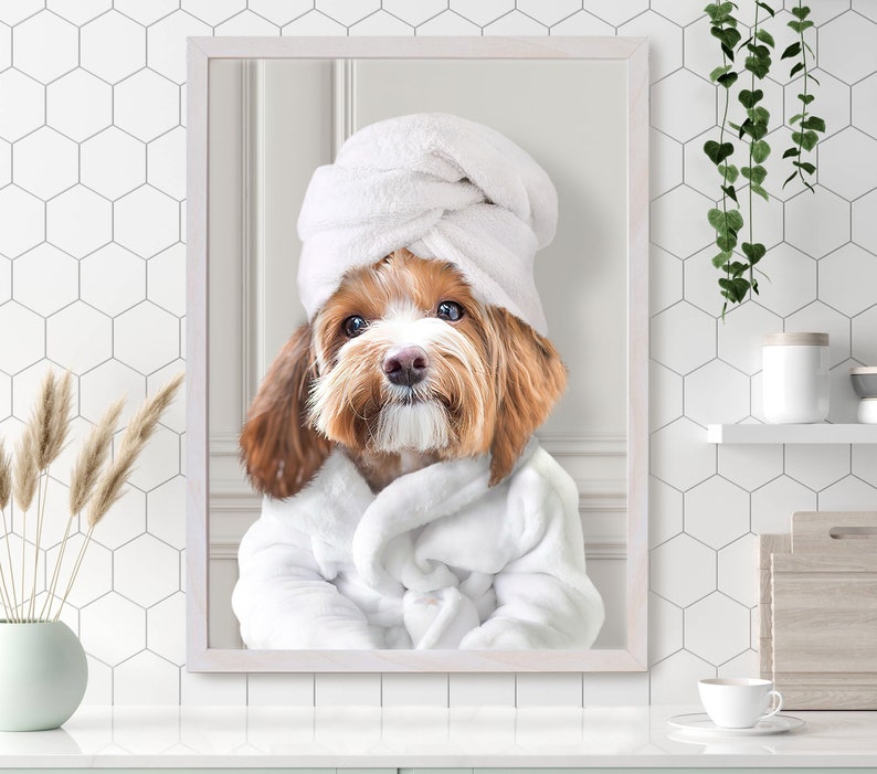May include: A brown and white dog wearing a white bathrobe and a white towel on its head. The dog is looking directly at the camera.