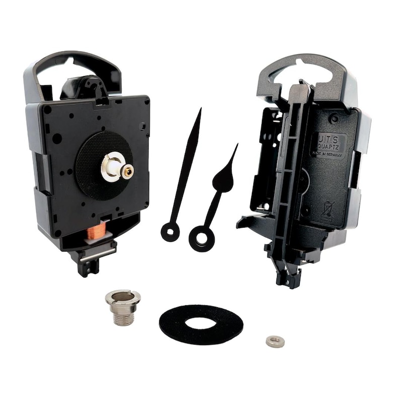May include: A black quartz clock movement kit with two hands, a mounting nut, a washer, and a small screw. The clock movement has a white label that reads "UTS QUARTZ MADE IN GERMANY".