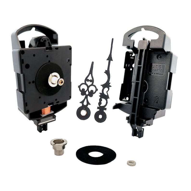 May include: Black clock movement kit with hands, a mounting bracket, a washer, and a nut. The clock movement has a quartz mechanism and is labeled "JITS QUARTZ MADE IN TAIWAN".