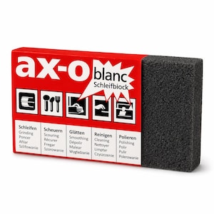 Pode incluir: Um bloco de lixa Schleifblock preto com uma caixa vermelha e branca. A caixa tem o texto "ax-o blanc" e vários ícones com palavras relacionadas como "Grinding" e "Polishing". O bloco tem uma forma retangular.
