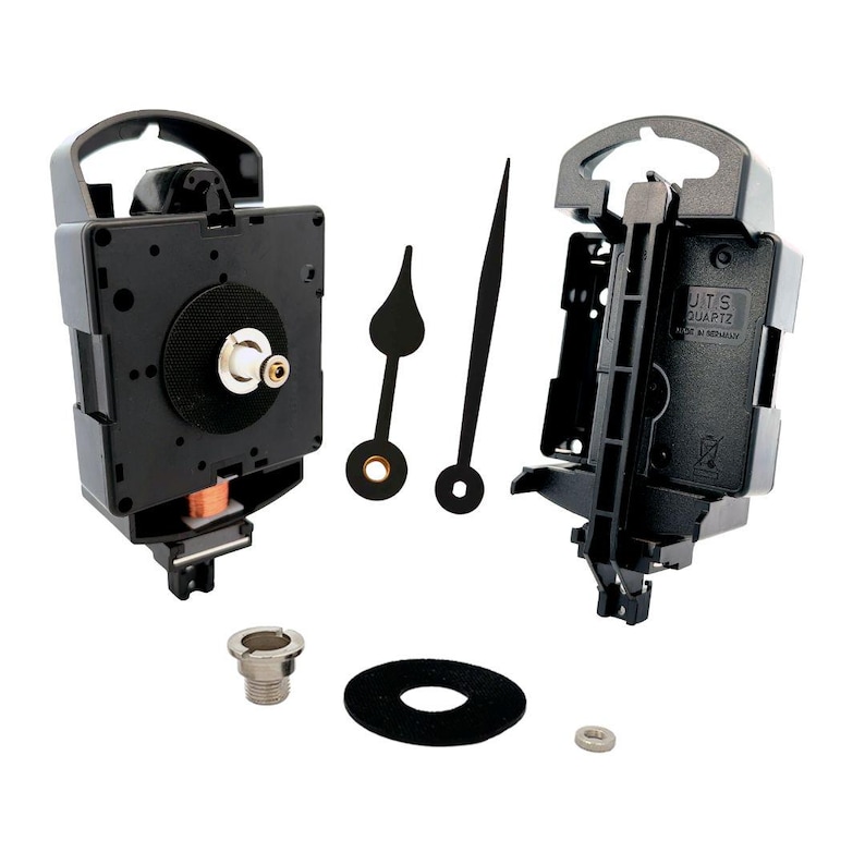 May include: A black clock movement kit with two black clock hands, a black washer, a silver nut, and a silver screw. The clock movement has a black plastic case with a white label that reads "J.U.T.S QUARTZ MADE IN GERMANY".