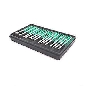 May include: A black plastic case containing a set of 20 silver metal tools with green handles. The tools have rounded tips and are arranged in rows.