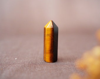 Tiger eye point, small gemstone obelisk as a spiritual gift