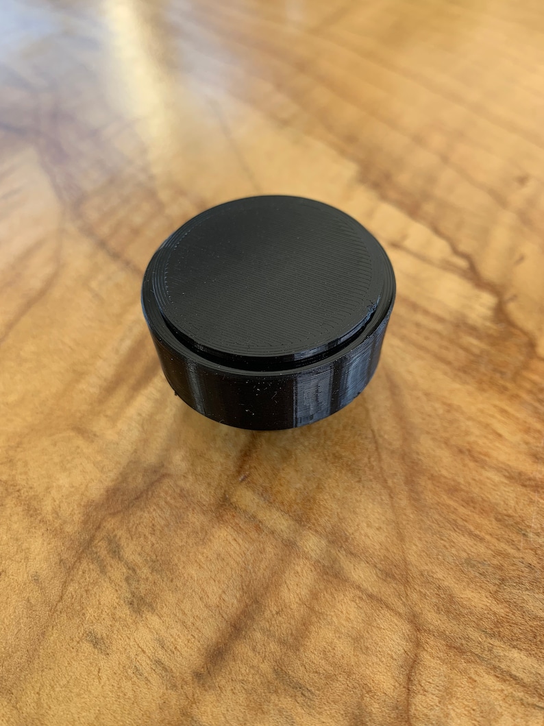 Underside of two part design that shows the cap installed.