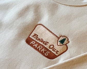 Embroidered ‘Protect Our Parks’ Sweatshirt | National Parks | Vintage Park Sign Design | Nature Lover Gift | Outdoor Hiking Crewneck